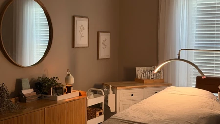 Warm treatment room lighting at Radiant Glow Skin Spa