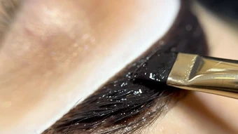 Brow tint application at Radiant Glow Skin Spa